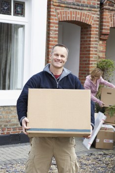 Removal van and moving boxes for a house move in Grahame Park