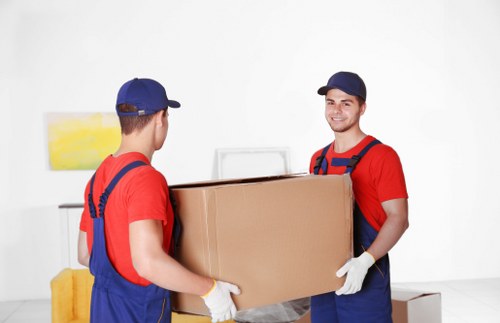 Man with van loading household items for transport