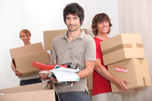House movers loading furniture for a move in Grahame Park