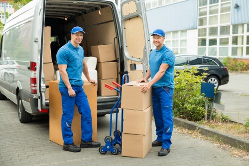 Moving van and packed boxes for a Grahame Park relocation
