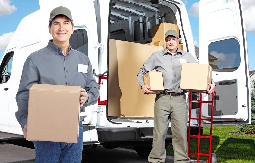 Removal crew handling office equipment with care