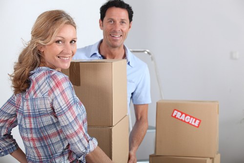 Removalists loading household items for a move in Grahame Park