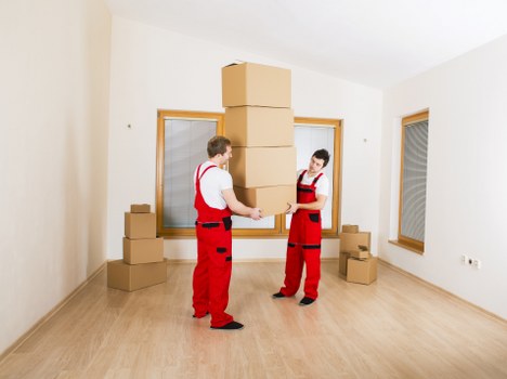 Careful furniture handling during a house move in Grahame Park